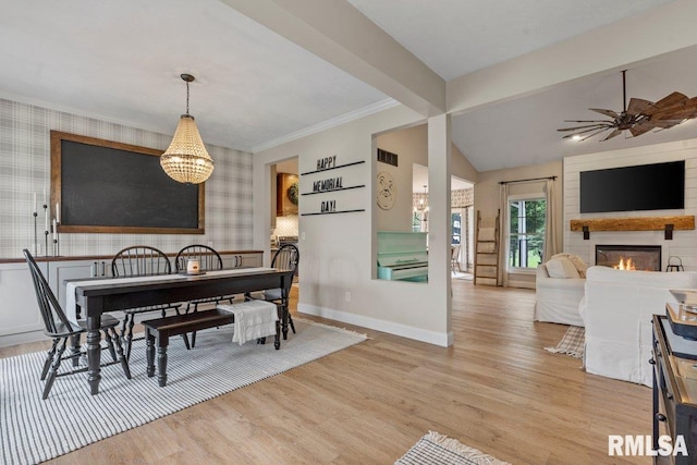 33 Vista Rdg, Petersburg, IL 62675 - dining room featuring wallpapered walls, light wood-type flooring, a glass covered fireplace, baseboards, and a chandelier