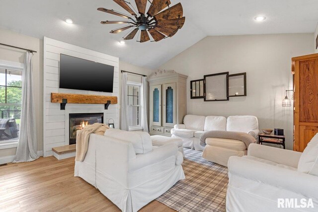 33 Vista Rdg, Petersburg, IL 62675 - living area featuring a large fireplace, lofted ceiling, and light wood-style floors