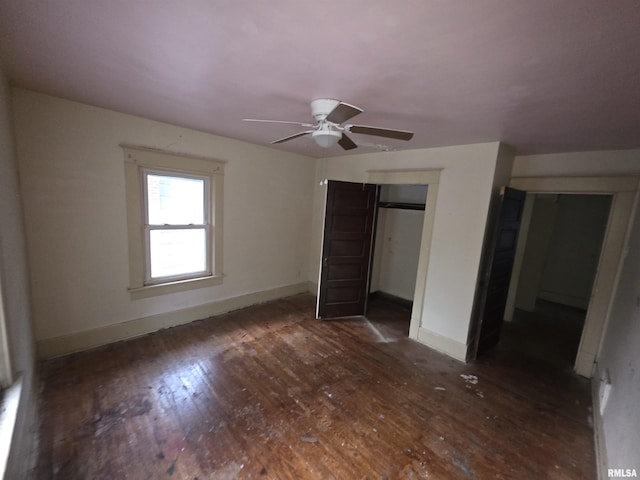 2040 S 5th St, Springfield, IL 62703 - unfurnished bedroom featuring wood finished floors, baseboards, and a closet