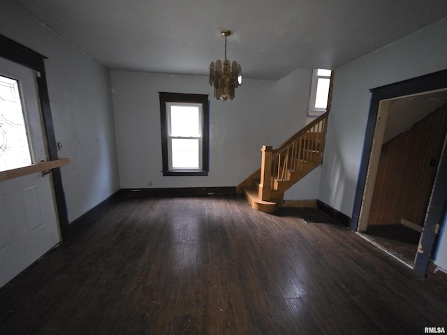 2040 S 5th St, Springfield, IL 62703 - unfurnished living room featuring wood-type flooring, stairs, a chandelier, and baseboards