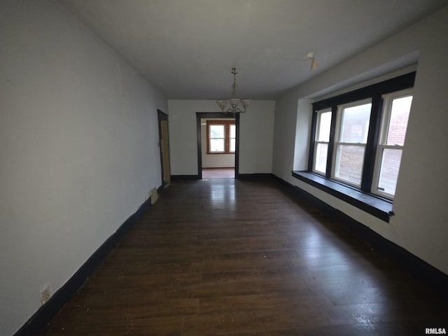 2040 S 5th St, Springfield, IL 62703 - unfurnished room with a chandelier, dark wood finished floors, and baseboards