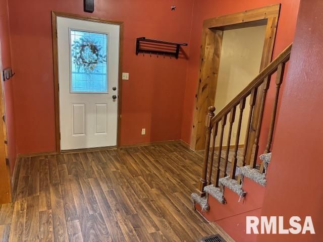 505 E Elm St, Carlinville, IL 62626 - foyer entrance featuring stairway, wood finished floors, and baseboards