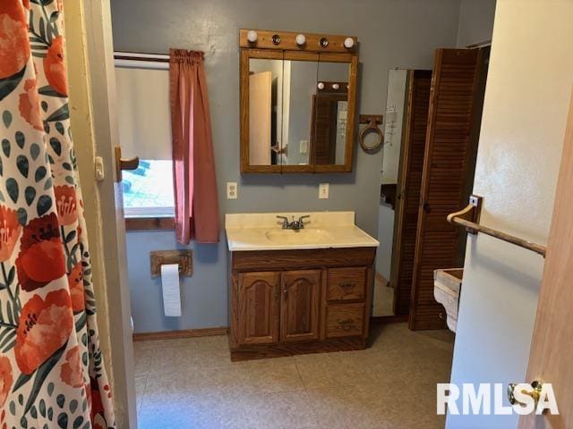 505 E Elm St, Carlinville, IL 62626 - bathroom featuring vanity, tile patterned floors, and curtained shower