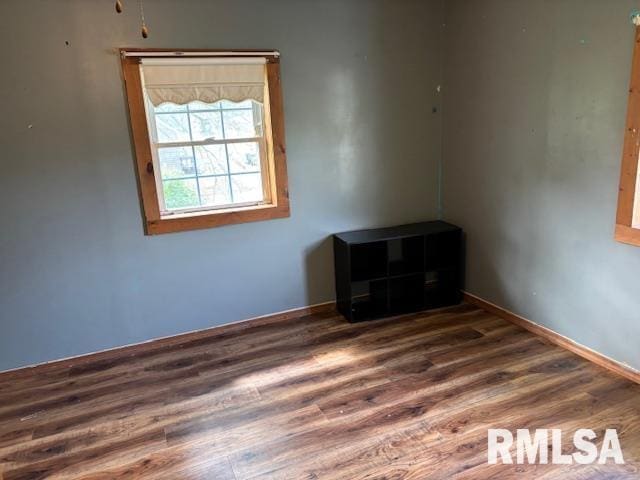 505 E Elm St, Carlinville, IL 62626 - unfurnished room featuring wood finished floors and baseboards