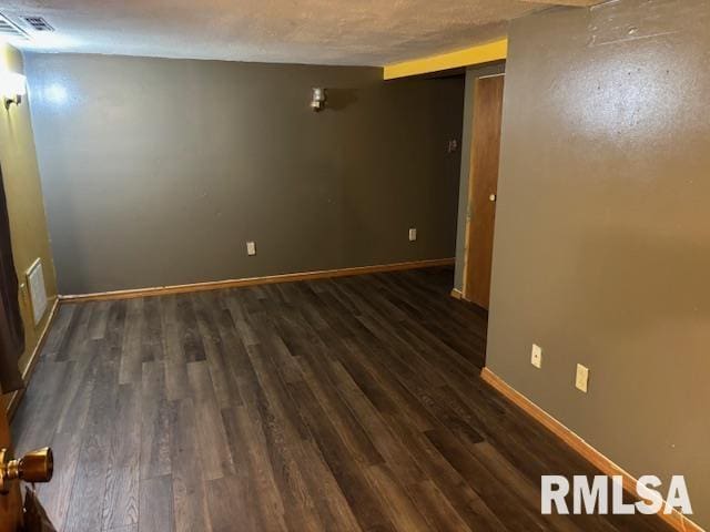 505 E Elm St, Carlinville, IL 62626 - unfurnished room featuring baseboards and wood finished floors