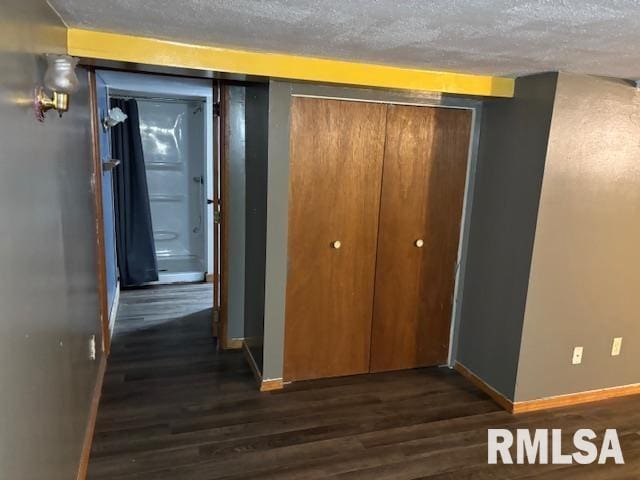 505 E Elm St, Carlinville, IL 62626 - hall featuring baseboards, dark wood-style floors, and a textured ceiling