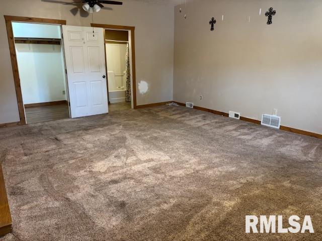 505 E Elm St, Carlinville, IL 62626 - unfurnished bedroom with carpet, baseboards, and ensuite bathroom