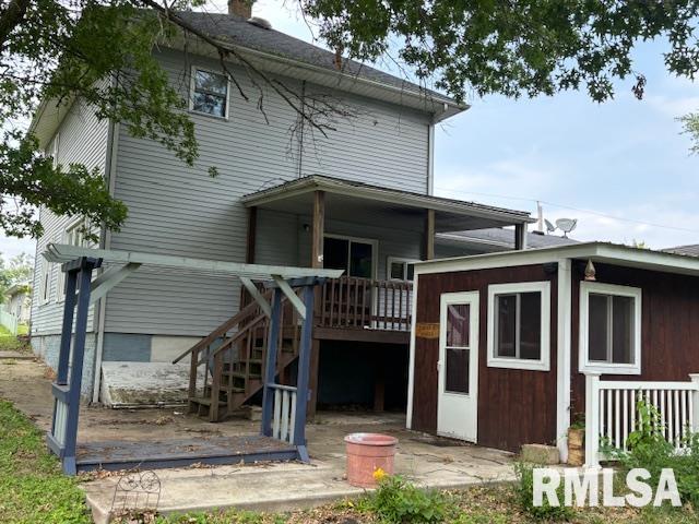 505 E Elm St, Carlinville, IL 62626 - back of property featuring stairs and a wooden deck