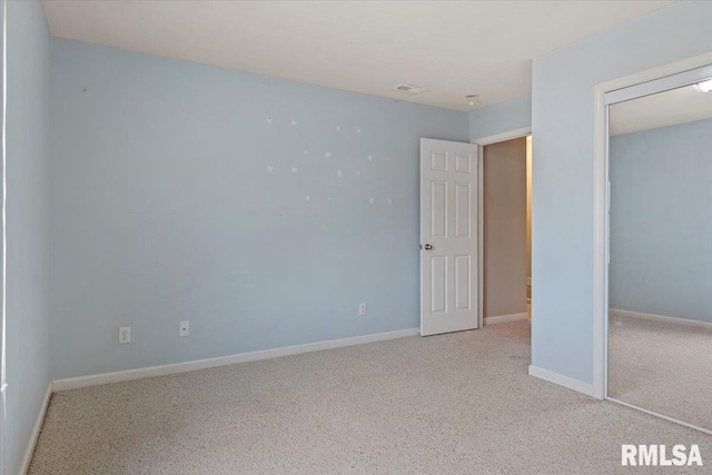 4108 Newtonmore Dr, Springfield, IL 62712 - unfurnished bedroom featuring light colored carpet, baseboards, and a closet