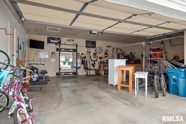4108 Newtonmore Dr, Springfield, IL 62712 - garage with a workshop area and a garage door opener