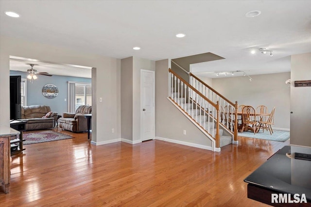 4108 Newtonmore Dr, Springfield, IL 62712 - living room featuring wood finished floors, stairway, ceiling fan, baseboards, and recessed lighting