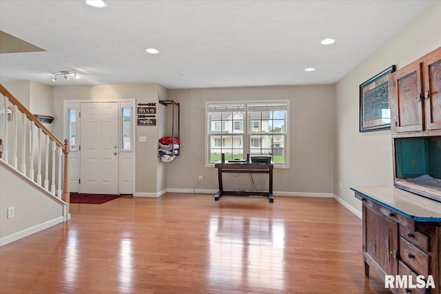 4108 Newtonmore Dr, Springfield, IL 62712 - entrance foyer featuring light wood-style flooring, stairway, baseboards, and recessed lighting