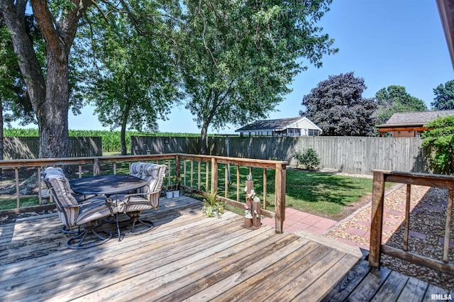 909 E Heights Ave, Taylorville, IL 62568 - wooden deck featuring outdoor dining space and a fenced backyard