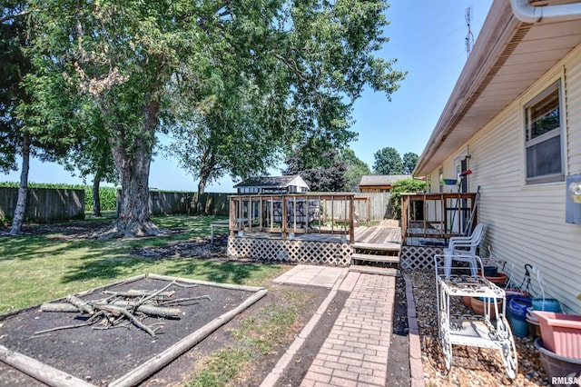 909 E Heights Ave, Taylorville, IL 62568 - fenced backyard with a deck