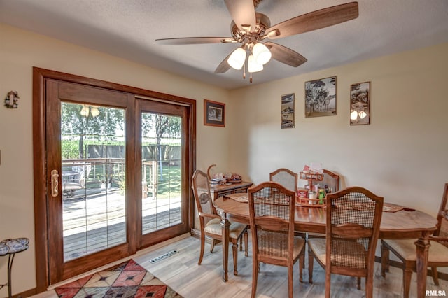 909 E Heights Ave, Taylorville, IL 62568 - dining room with ceiling fan and light wood finished floors
