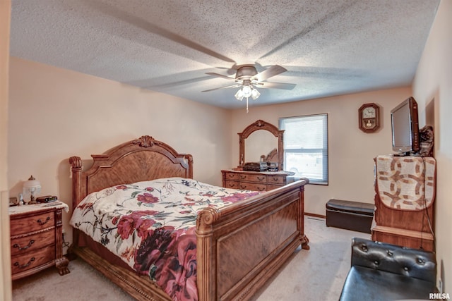 909 E Heights Ave, Taylorville, IL 62568 - bedroom featuring light carpet, a ceiling fan, and a textured ceiling