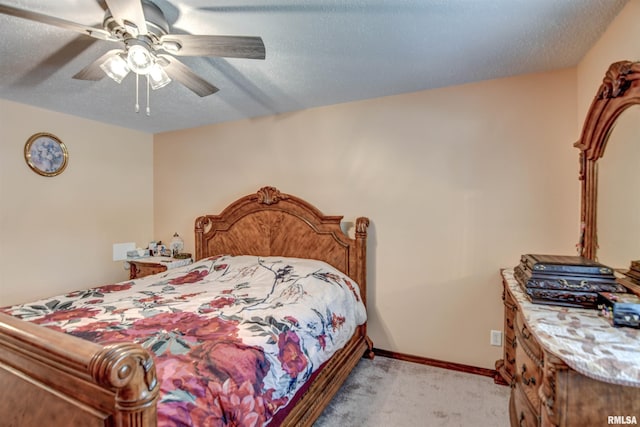 909 E Heights Ave, Taylorville, IL 62568 - bedroom featuring light carpet, a ceiling fan, and a textured ceiling
