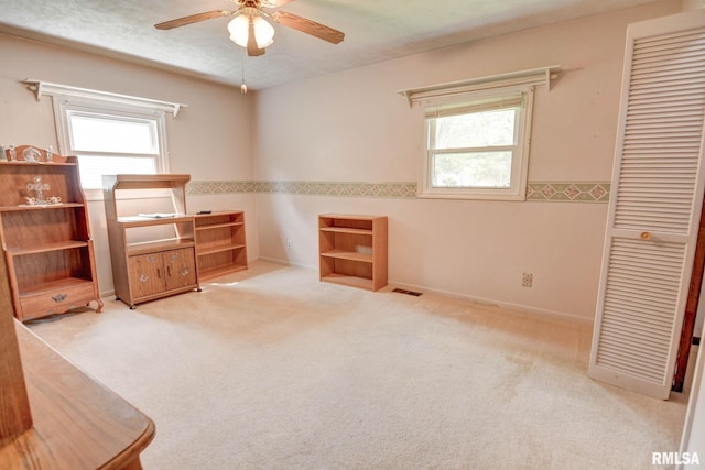 128 Macarthur Blvd, Pana, IL 62557 - unfurnished bedroom with carpet, a closet, a ceiling fan, and baseboards