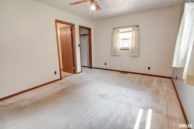 128 Macarthur Blvd, Pana, IL 62557 - empty room with ceiling fan, light carpet, and baseboards