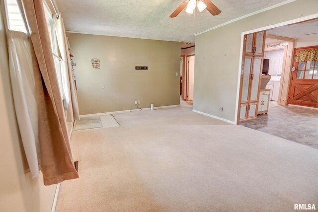 128 Macarthur Blvd, Pana, IL 62557 - carpeted spare room featuring ceiling fan, baseboards, and a textured ceiling