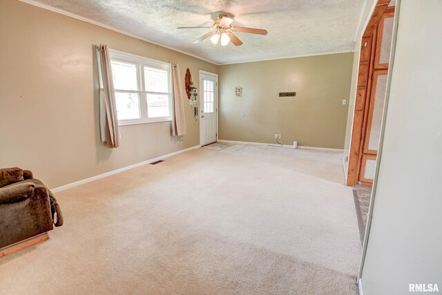 128 Macarthur Blvd, Pana, IL 62557 - carpeted empty room with a ceiling fan, a textured ceiling, baseboards, and ornamental molding