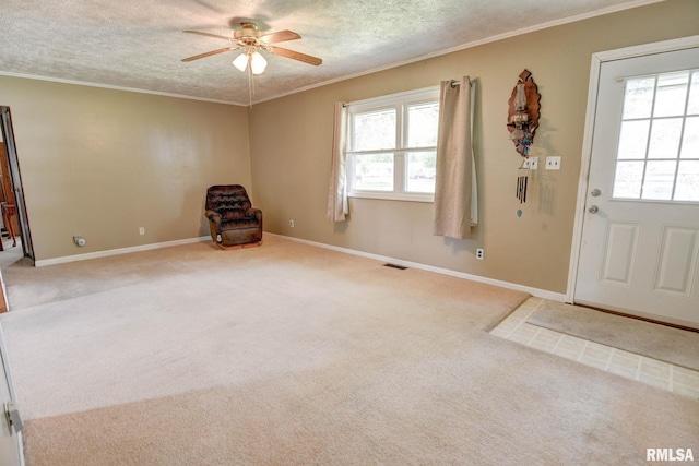 128 Macarthur Blvd, Pana, IL 62557 - carpeted entrance foyer with a ceiling fan, ornamental molding, a textured ceiling, and baseboards