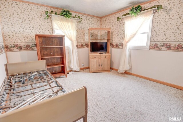 128 Macarthur Blvd, Pana, IL 62557 - bedroom with wallpapered walls, ornamental molding, light colored carpet, and baseboards