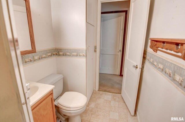 128 Macarthur Blvd, Pana, IL 62557 - half bathroom with vanity and toilet