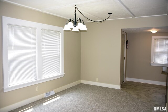 2531 Yale Blvd, Springfield, IL 62703 - unfurnished dining area with a chandelier, carpet flooring, and baseboards