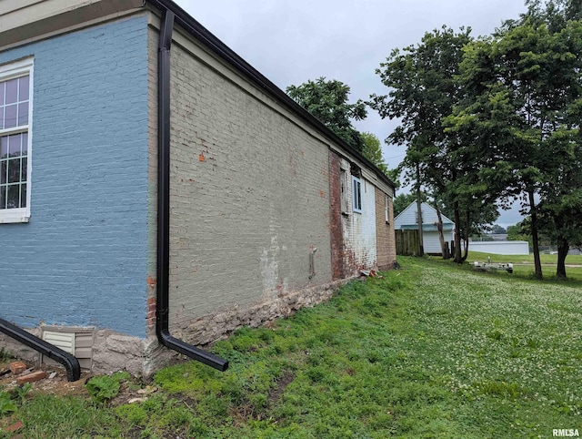 420 Kentucky St, Quincy, IL 62301 - view of property exterior with a lawn, brick siding, and a water view