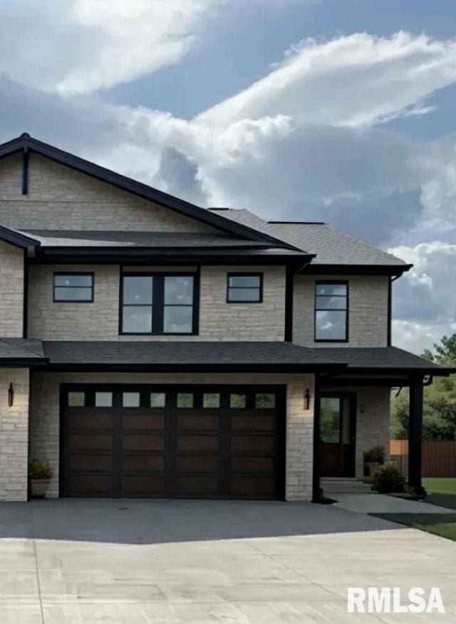 3802 Sugar Loaf Dr, Springfield, IL 62711 - view of front of home with concrete driveway, an attached garage, and stone siding