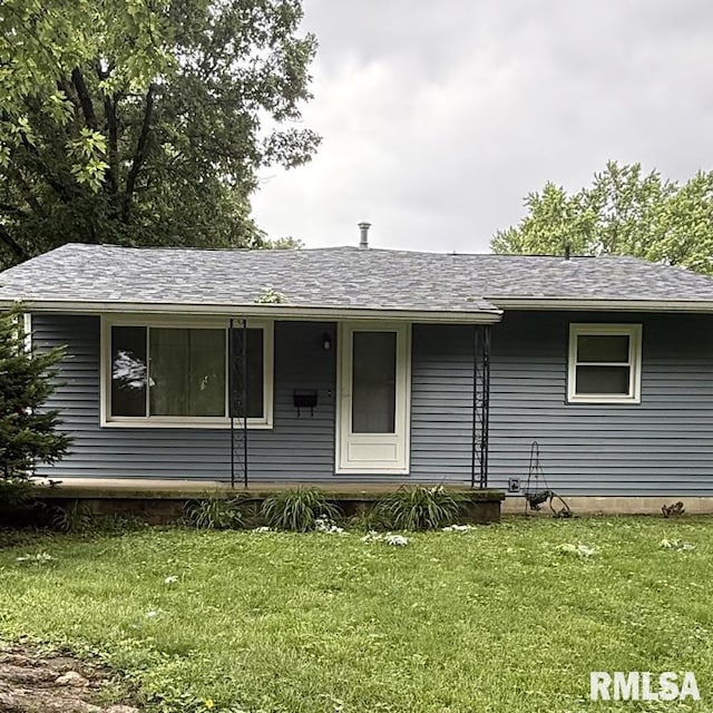 504 W Chestnut St, Chatham, IL 62629 - view of front of property with a front lawn, roof with shingles, and covered porch