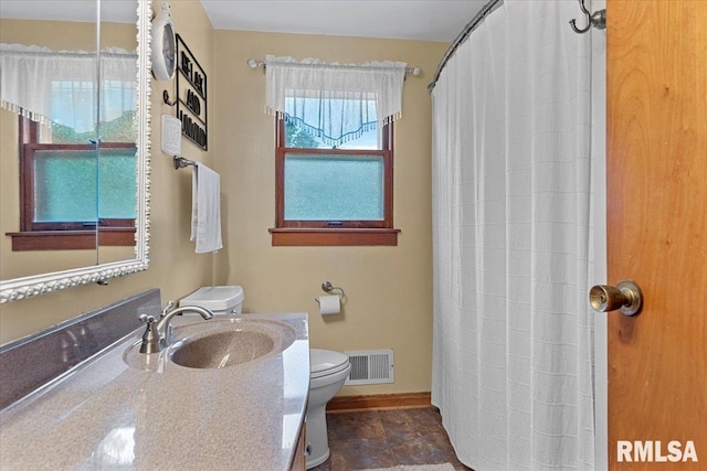 2054 Cambridge Rd, Springfield, IL 62704 - bathroom with toilet, vanity, baseboards, and a shower with shower curtain