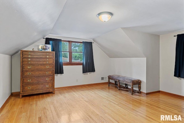 2054 Cambridge Rd, Springfield, IL 62704 - additional living space featuring light wood-style floors, vaulted ceiling, and baseboards