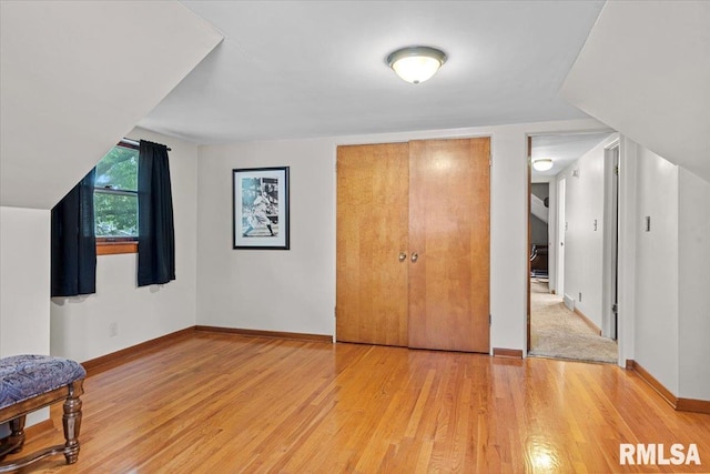 2054 Cambridge Rd, Springfield, IL 62704 - unfurnished bedroom featuring light wood finished floors, baseboards, and a closet