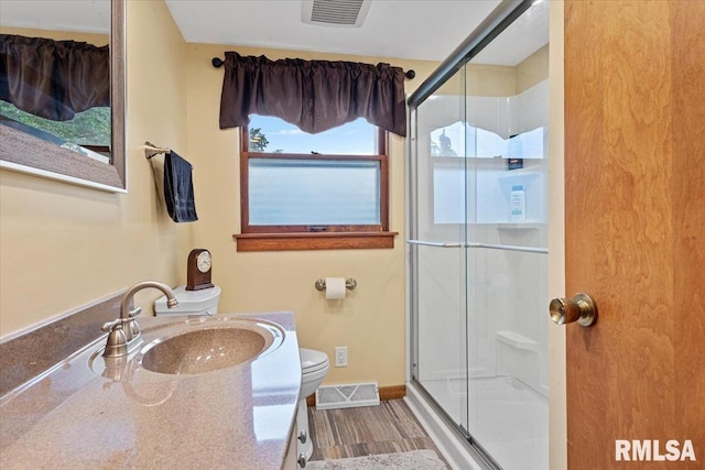 2054 Cambridge Rd, Springfield, IL 62704 - full bathroom with toilet, a shower stall, vanity, and wood finished floors