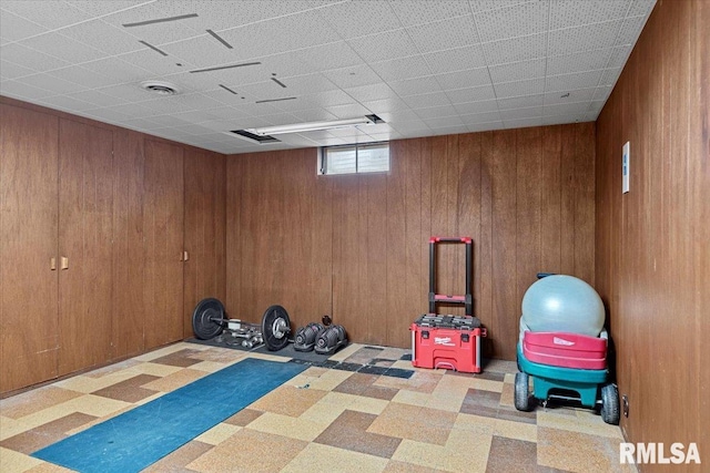 2054 Cambridge Rd, Springfield, IL 62704 - exercise room featuring tile patterned floors and wood walls