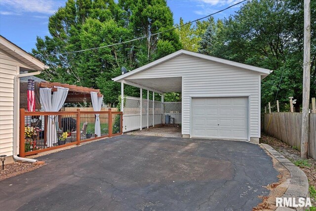122 W Chapin St, Litchfield, IL 62056 - garage with asphalt driveway and a detached garage