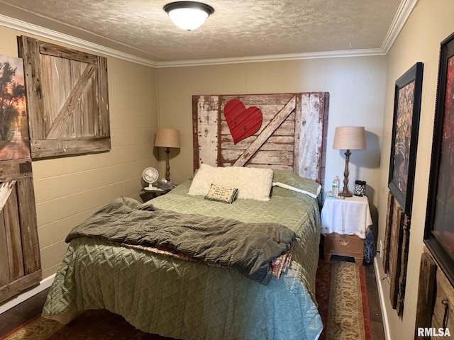 100 Fulton St, Oquawka, IL 61469 - bedroom featuring a textured ceiling, concrete block wall, crown molding, and wood finished floors