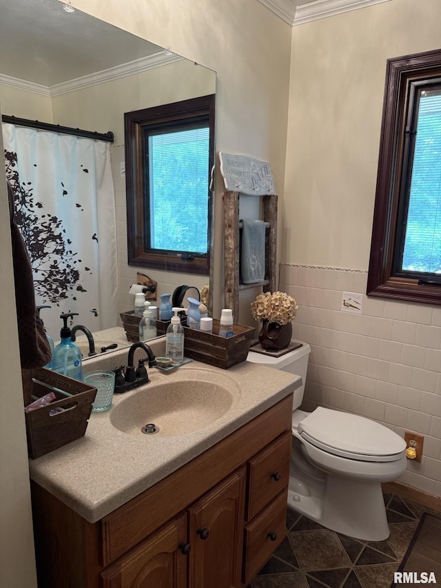 100 Fulton St, Oquawka, IL 61469 - full bathroom with crown molding, tile walls, vanity, toilet, and a wainscoted wall
