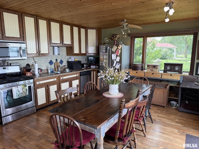 100 Fulton St, Oquawka, IL 61469 - kitchen with appliances with stainless steel finishes, wooden ceiling, a ceiling fan, backsplash, and light wood-style flooring