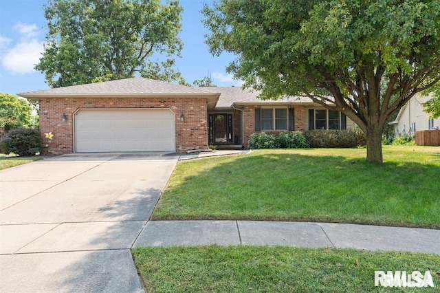 136 Lilac Ln, Chatham, IL 62629 - ranch-style home featuring a garage, concrete driveway, brick siding, and a front lawn