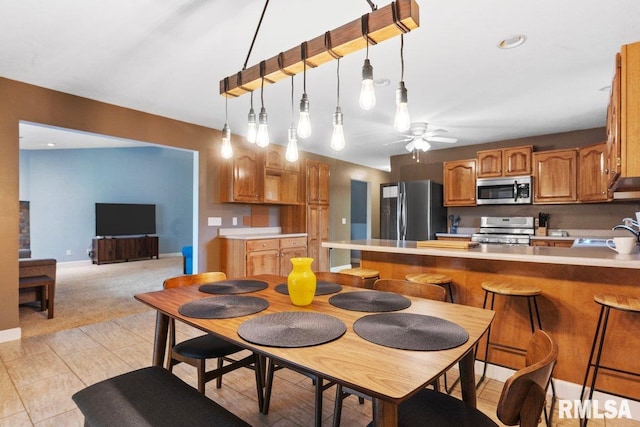 136 Lilac Ln, Chatham, IL 62629 - dining area with a ceiling fan and baseboards