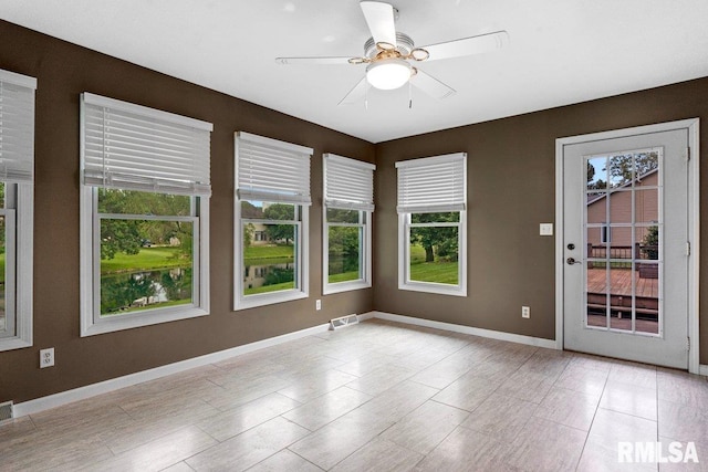 136 Lilac Ln, Chatham, IL 62629 - spare room with ceiling fan, healthy amount of natural light, and baseboards