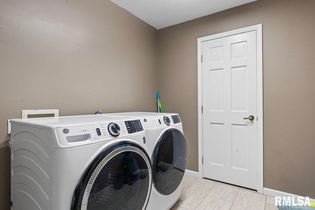136 Lilac Ln, Chatham, IL 62629 - washroom with washing machine and clothes dryer and baseboards