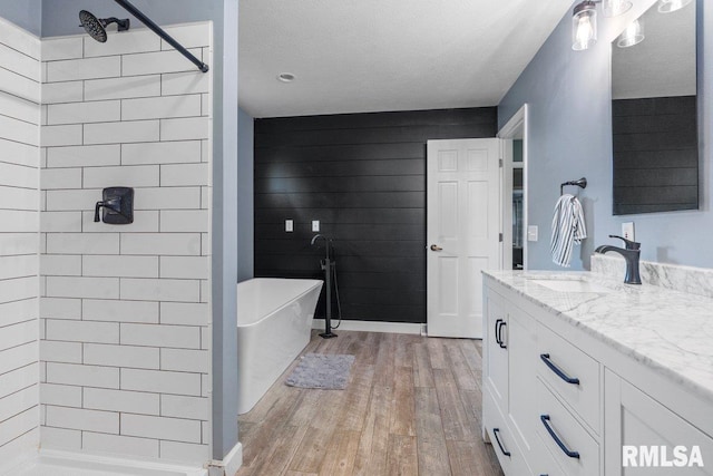 136 Lilac Ln, Chatham, IL 62629 - full bath with hardwood / wood-style flooring, vanity, a tile shower, and a soaking tub