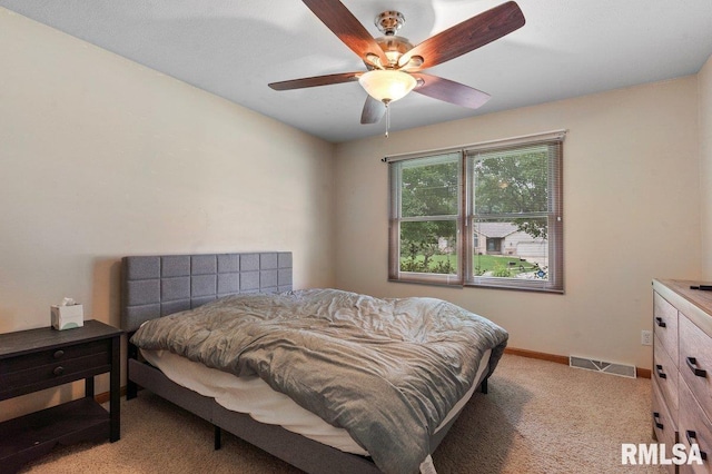 136 Lilac Ln, Chatham, IL 62629 - bedroom featuring light carpet, baseboards, and a ceiling fan
