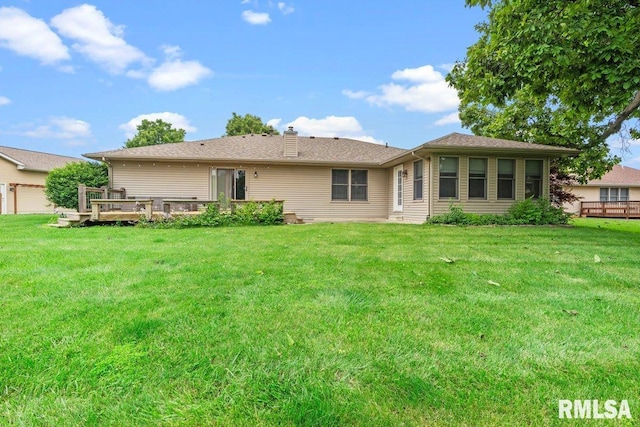 136 Lilac Ln, Chatham, IL 62629 - back of property with a lawn, a deck, and a chimney