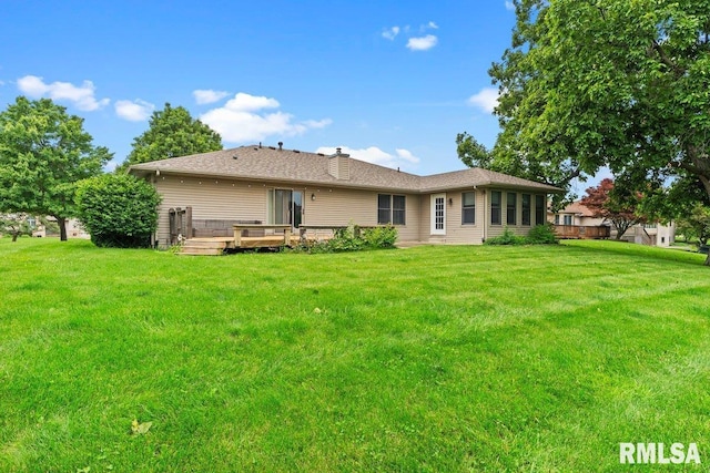 136 Lilac Ln, Chatham, IL 62629 - back of property with a yard, a deck, and a chimney