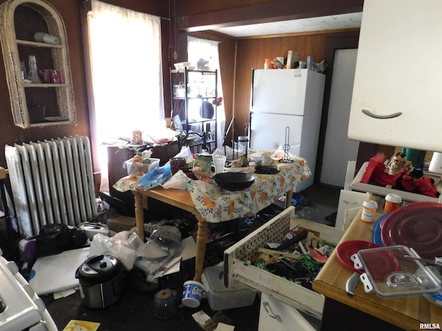 208 W Reynolds St, Springfield, IL 62702 - kitchen with radiator heating unit and freestanding refrigerator